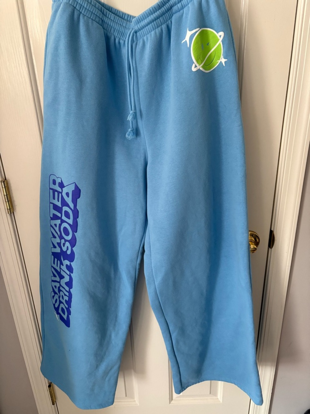 Popi Blue Sweatpants with Purple Graphic and Green Planet Accent